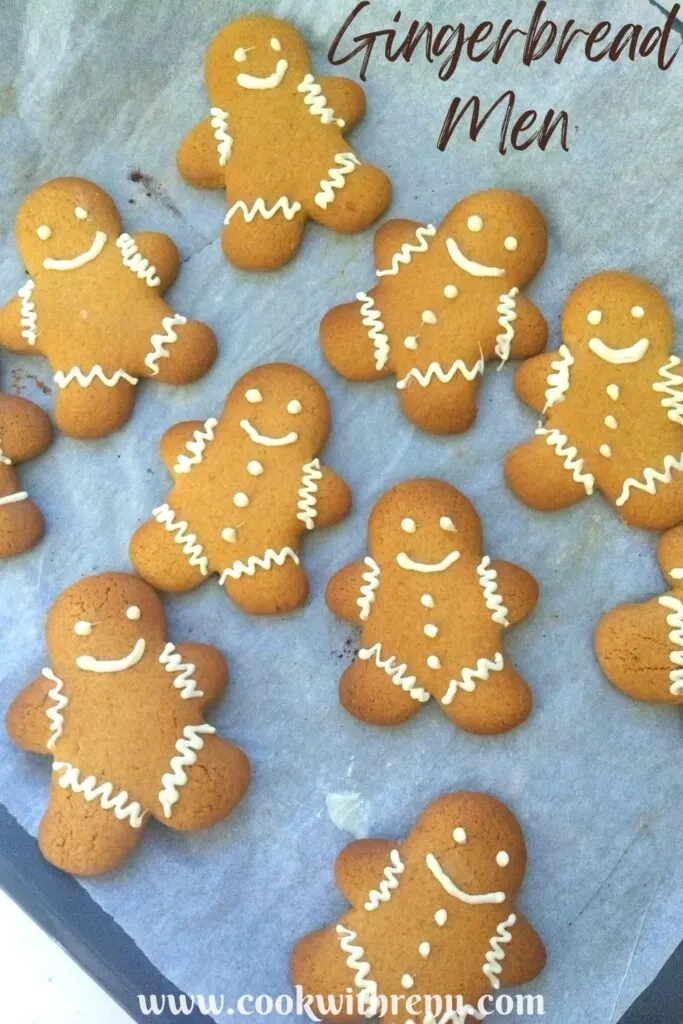 Gingerbread men cookies arranged on a baking tray