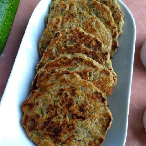 Zucchini / Courgette Fritters (Mini Pan Cakes) are healthy, low carb, gluten free and Vegan starter or a side which can be made in as quickly as 10 minutes.