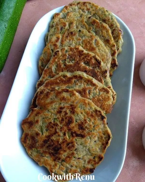 Zucchini / Courgette Fritters (Mini Pan Cakes) are healthy, low carb, gluten free and Vegan starter or a side which can be made in as quickly as 10 minutes.