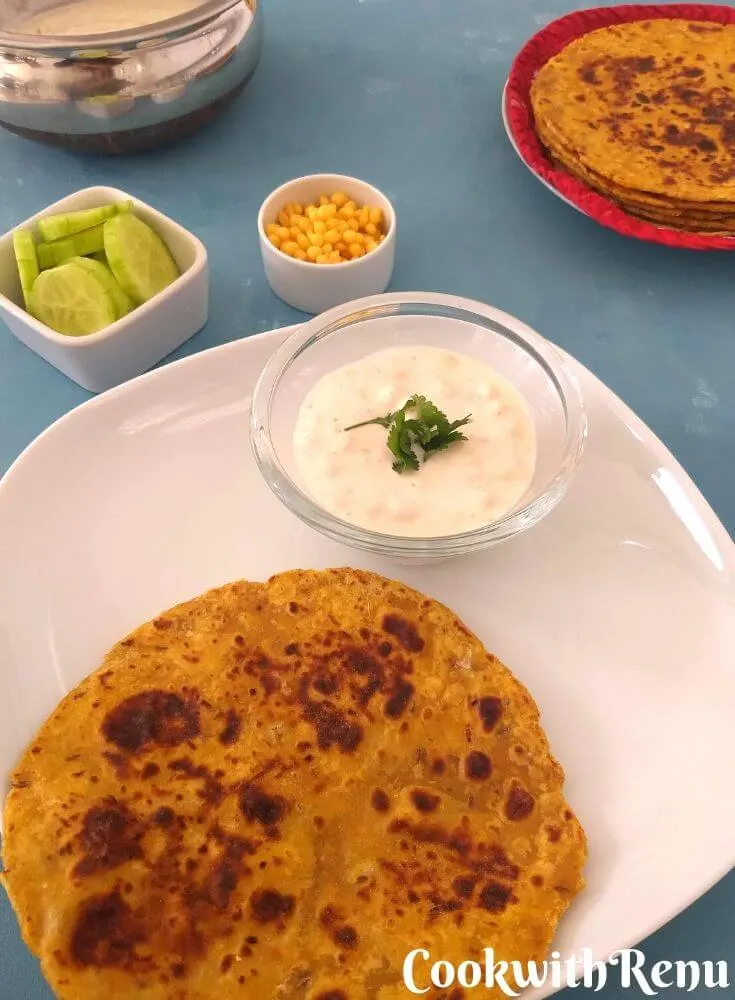 Cabbage Paratha Served with Boondi Raita