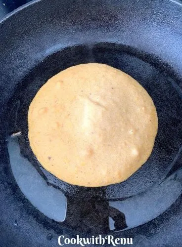 The pancake starting getting cooked on the bottom