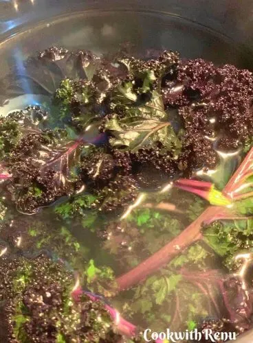 Kale dipped in cold water after being immersed in hot boiling water briefly