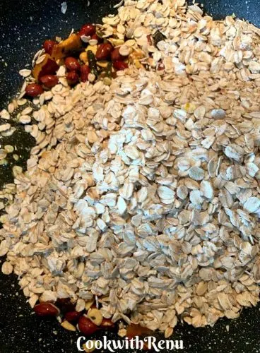 Adding of Roasted Oats to the nuts and oil mix
