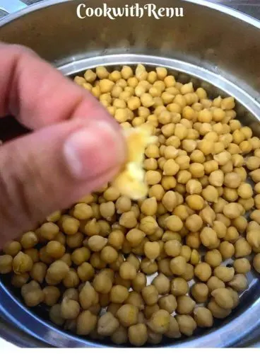 Cooked chickpeas , they have a bite not completely soggy. Should be able to squeeze or press between your fingers