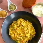 Daliya & Split Green Moong Dal Khichdi presented along with Homemade Aloo Papad and Yogurt