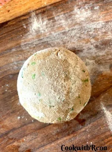 Dough ball being ready to roll, dusted in flour