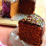Slice of chocolate cake being served