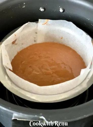 Cake batter ready to be baked in pressure cooker and set on a ring or a stand in pressure cooker