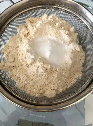 Sifting of the dry ingredients, that is flour, baking powder, baking soda and salt