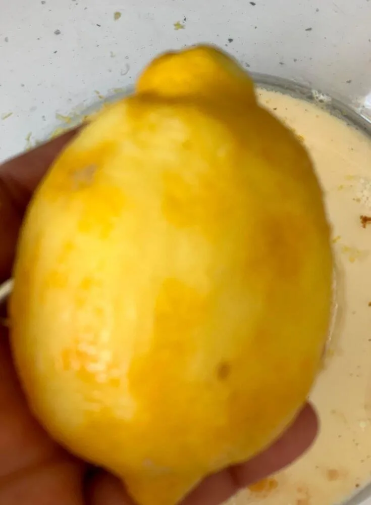 The Lemon Zest being removed, a close up look of the lemon after