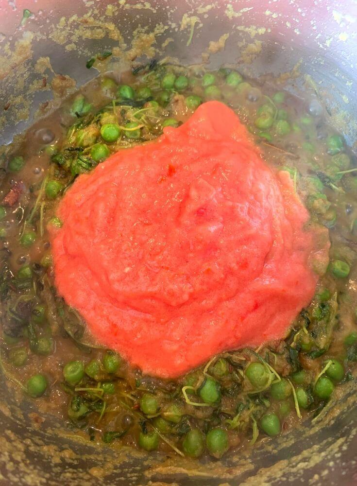 Adding of Fresh Tomato Puree to the Onion and Veggie Mix
