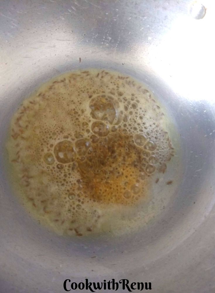 The tadka of oil, asafoetida and cumin seeds