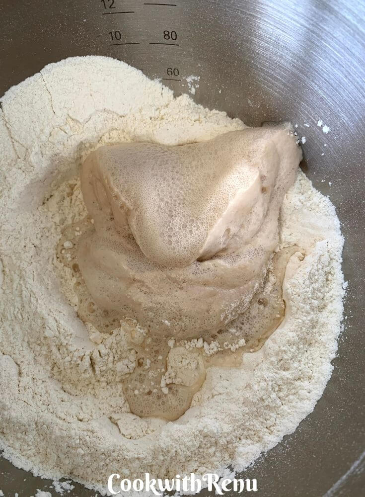 Adding of yeast mixture to the flour
