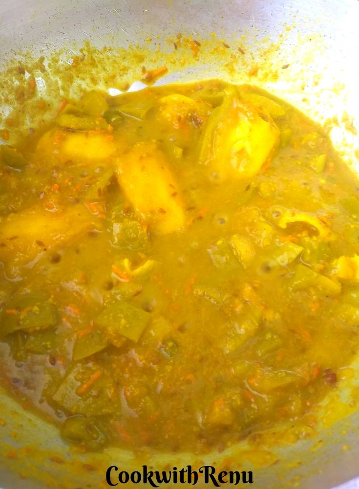 The raw mango is done cooking and is soft