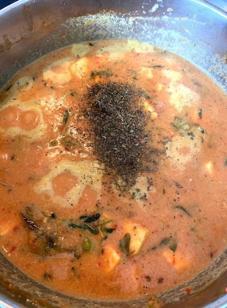 Adding Roasted and Crushed Kasuri Methi to the gravy
