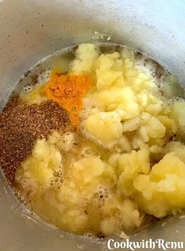 Dry masala's added to the gravy, that is turmeric and coriander powder