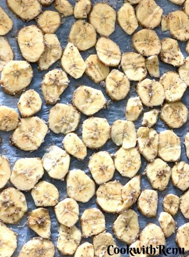 Banana Slices arranged in a baking tray in a single line ready to be baked