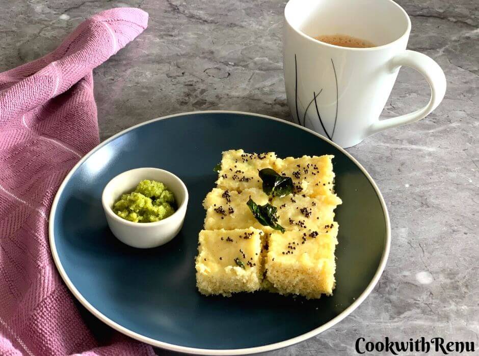 Rava Dhokla being served with Green Coriander Chutney and a cup of tea