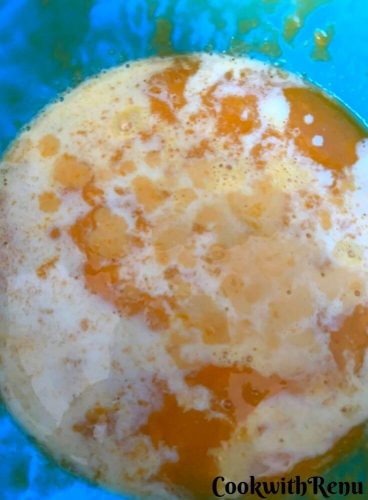 Adding of milk in the mango puree