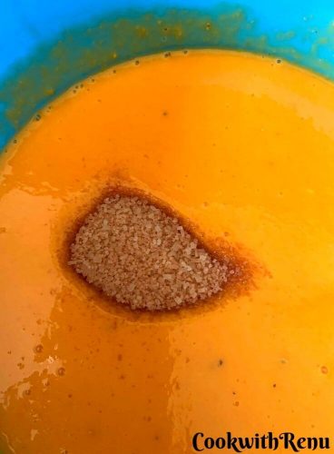 Adding sugar in the mango puree