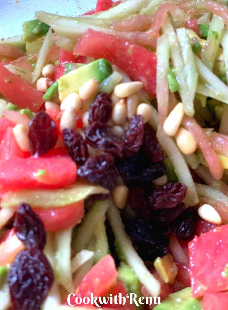 Adding of Raisins in the salad