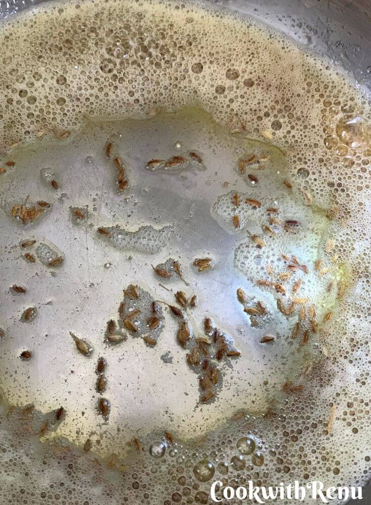 Adding of Jeera in ghee (clarified Butter)