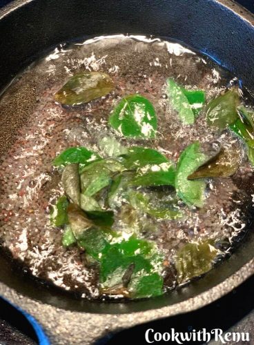 Tempering with oil, mustard seeds and curry leaves