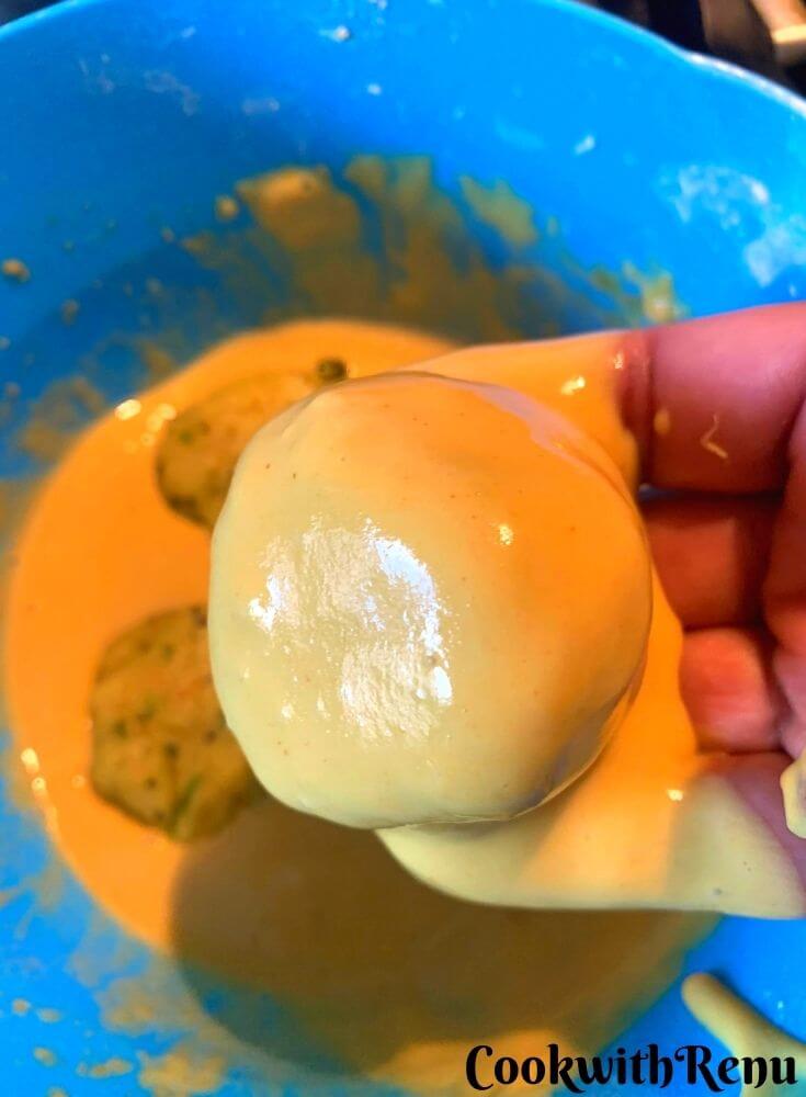 Dipping of the vada in the gram flour batter