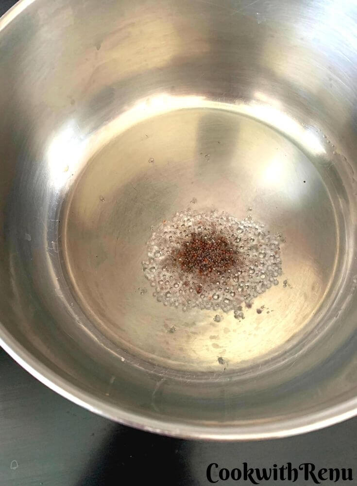 Adding mustard seeds in the oil