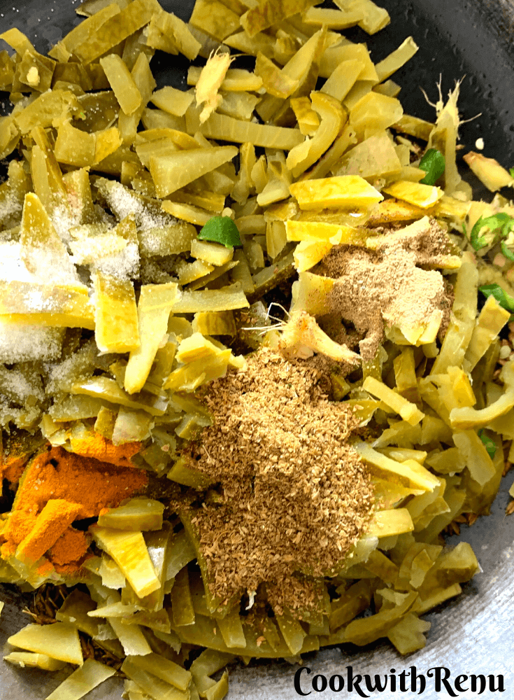 The spices, turmeric, green chillies, corainder, garam masala and salt added