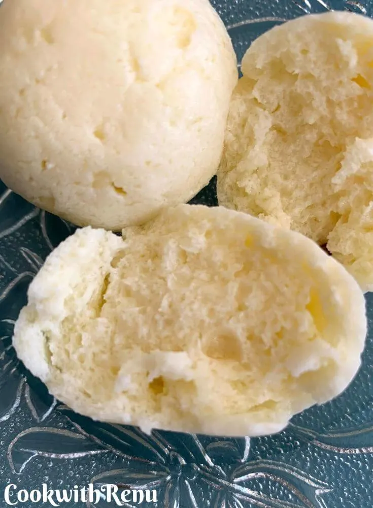 Inside soft texture of rasgulla seen with 1 rasgulla piece cut and 1 whole
