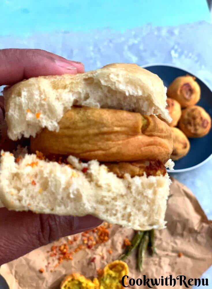 Close up look of the Street food vada pao sandwich, held in a hand