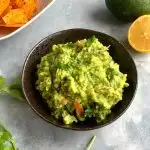 Easy Chunky Avocado Guacamole is a dip or a salad made using Avocado, Tomato, Onion and a few other ingredients. It goes well with some chips, nachos, pita bread or crackers.