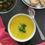 Takachi Kadhi or Maharashtrian kadhi served in a bowl with 2 phulkas and a sabji
