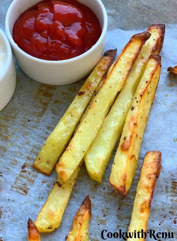 Close up look of Baked Crispy Potato Chips with tomato ketchup