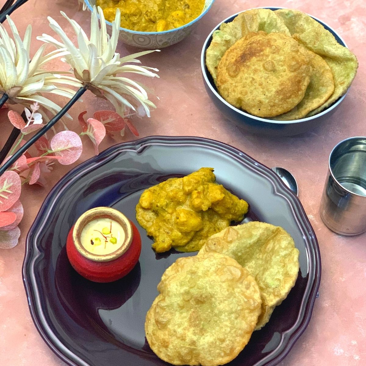 Bengali Breakfast thali is a lip-smacking vegetarian no onion no garlic thali, featuring famous Koraishutir Kochuri, Niramish Aloo Dum, and Mishti Doi.