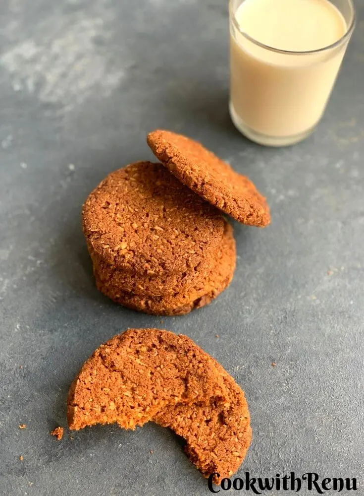 Top view of eggless, gluten-free and nut-free cookies are eggless, gluten-free and nut-free melt in mouth cookies. Crunchy on the outside and soft on inside. They are served along with a glass of milk.