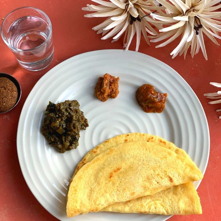 Chilka Roti is a popular breakfast recipe, made using Rice and Chana dal. A perfect balance of carbs and proteins. Served with Garlic Chutney, Tomato Chutney and Baingan Choka and Baked Bajra Tikki