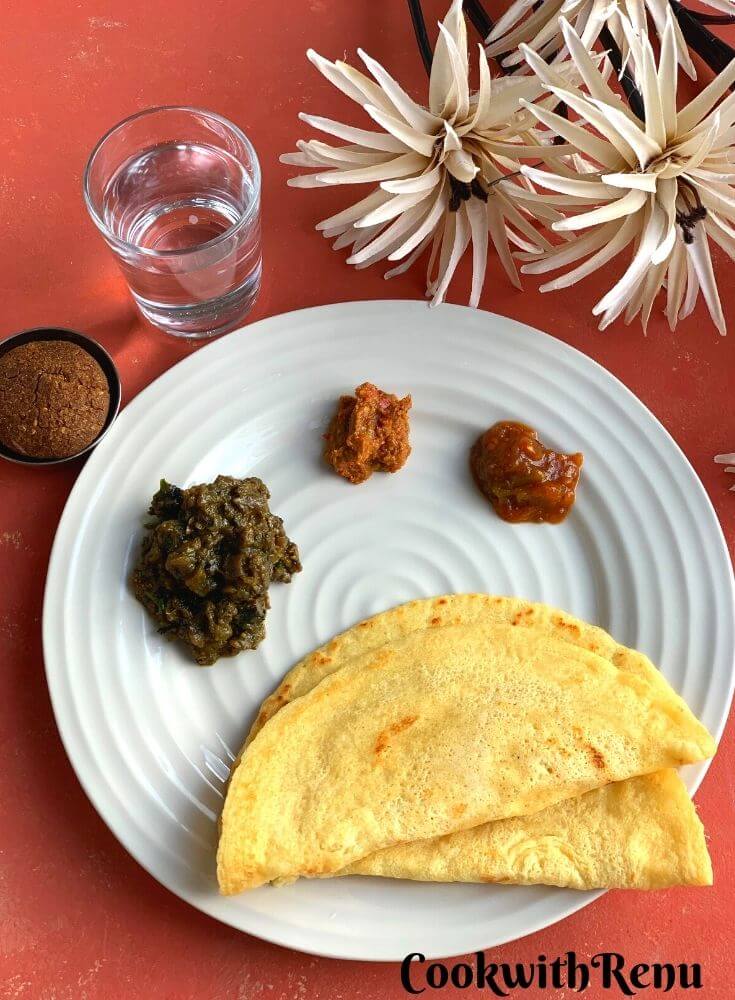 Chilka Roti is a popular breakfast recipe, made using Rice and Chana dal. A perfect balance of carbs and proteins. Served with Garlic Chutney, Tomato Chutney and Baingan Choka and Baked Bajra Tikki