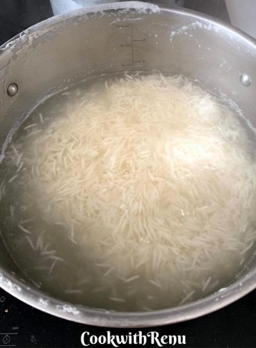 Rice getting steamed in a large pot