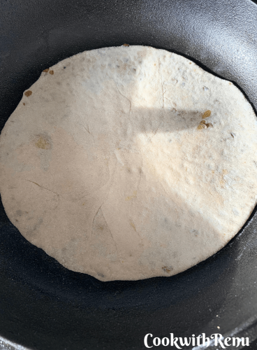 Shallow frying the flatbread on the griddle/tawa
