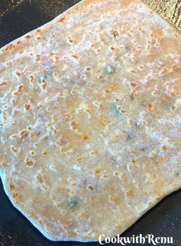 The first cooking on the underside of the paratha