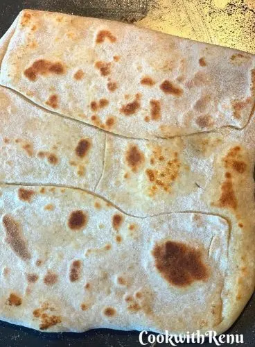 Paratha getting cooked on the underside