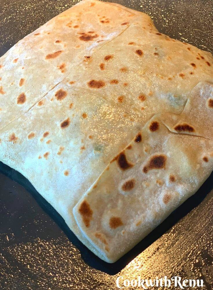 Paratha getting cooked. All puffed up