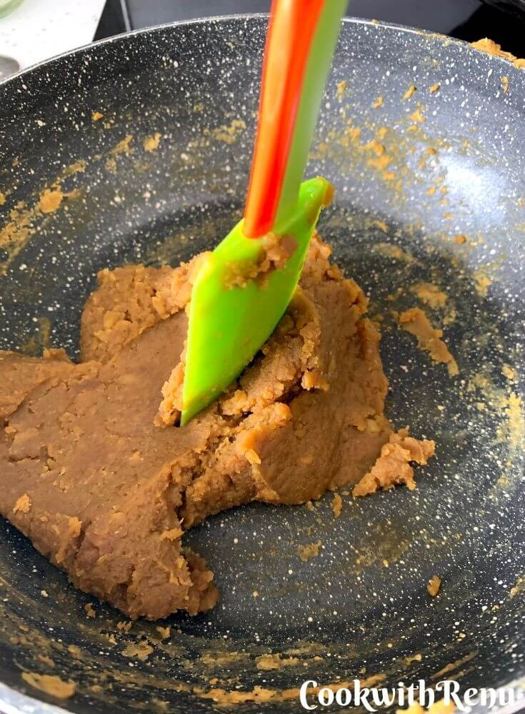 The ready puran. A laddle standing straight in the puran, indicating it is done