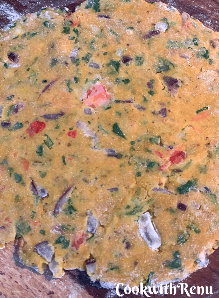 Rolling out of the paratha