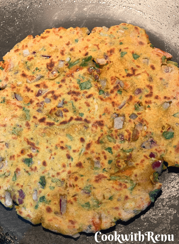 Flatbread being shallow fried on the griddle