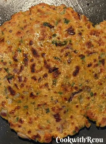 Flatbread being shallow fried on the griddle