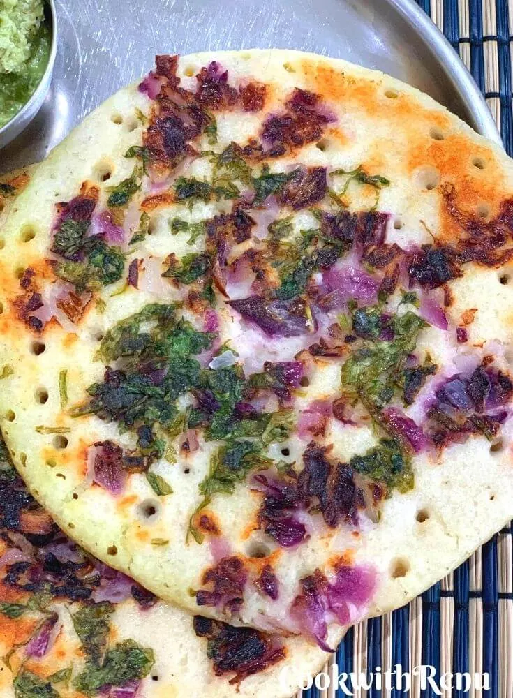 Close up look of Uttapam served in a plate, with clear distinct pores seen and soft texture and cripy edges