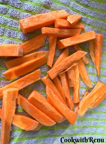 Carrot getting dry on a clean kitchen towel